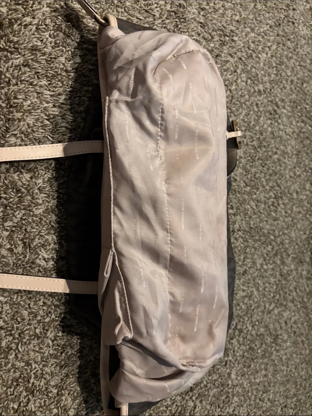 Michael Kors Brown Tote with tan trim does have some spots on inside